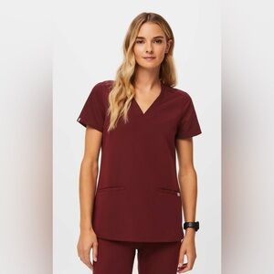 Figs three pocket scrub top.  NWOT!  Size small.  Color is burgundy.